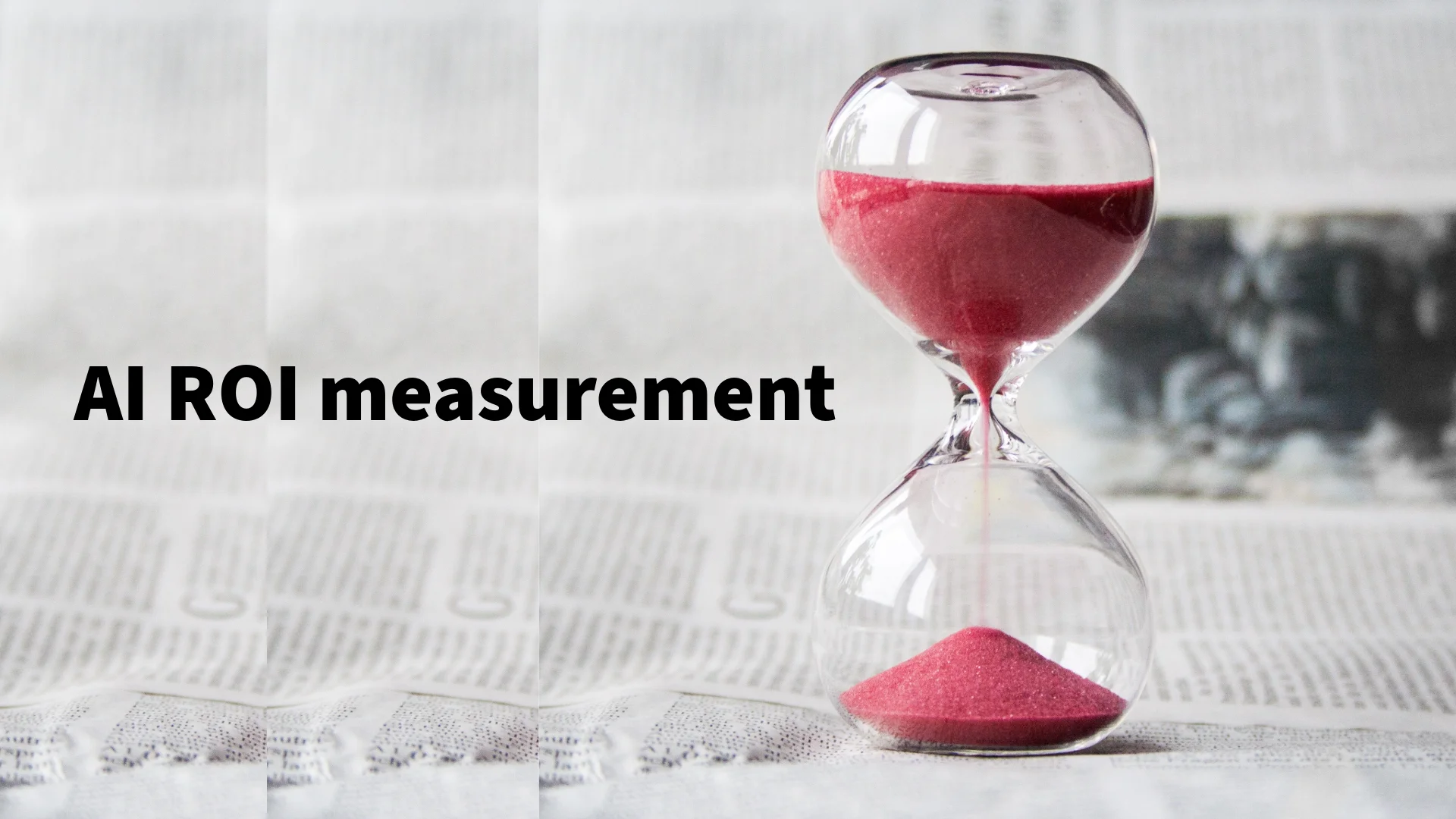 An hourglass with red sand beside the words “AI ROI measurement.”